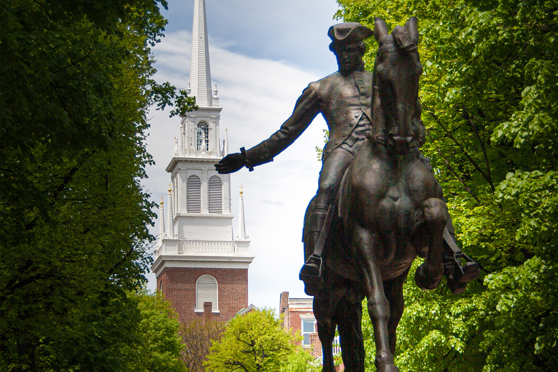 A Statue of Paul Revere in front of the historic old church in Boston